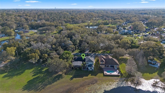 bird's eye view featuring a view of trees and a water view