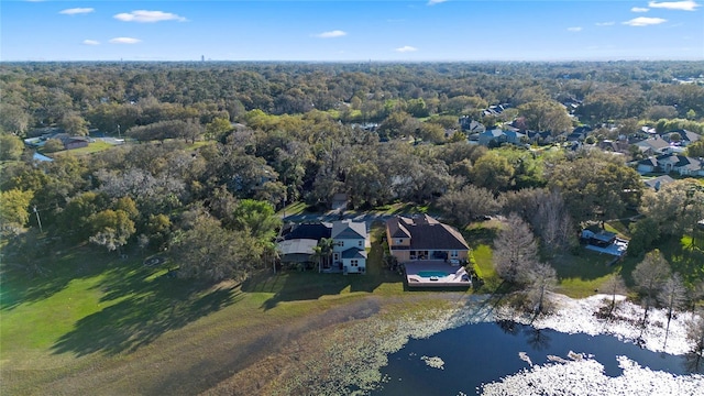 aerial view featuring a view of trees and a water view