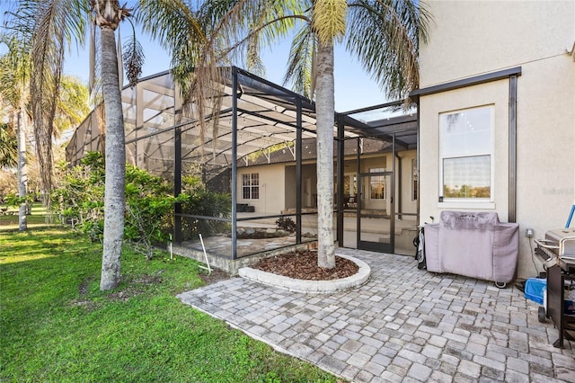 view of patio with glass enclosure