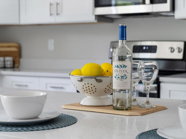 room details with white cabinets and range