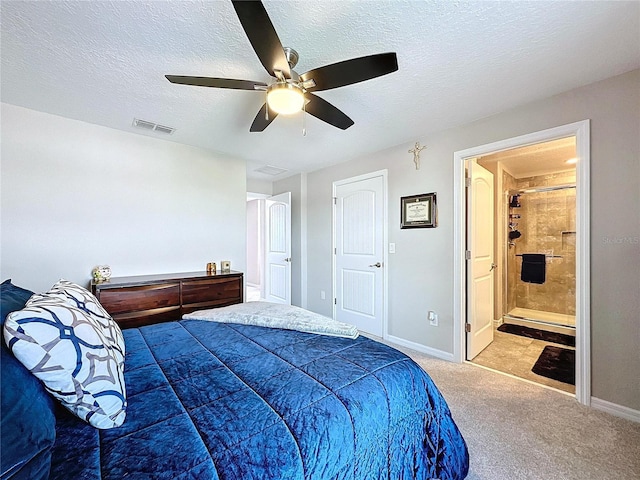 bedroom with a textured ceiling, carpet, visible vents, and baseboards