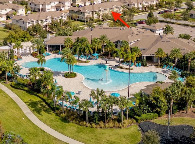 view of pool with a residential view