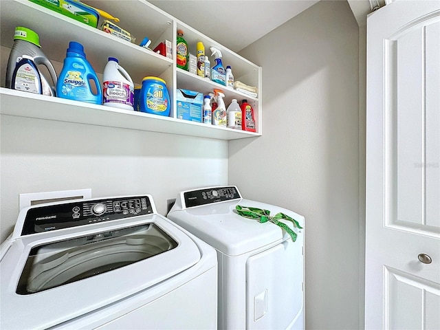 washroom with laundry area and independent washer and dryer