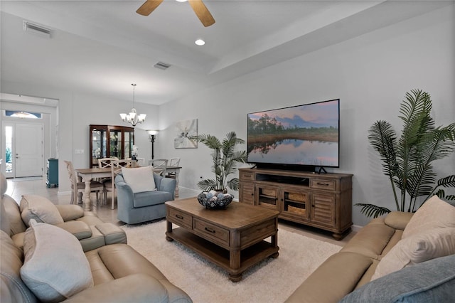 living area featuring baseboards, ceiling fan with notable chandelier, visible vents, and recessed lighting