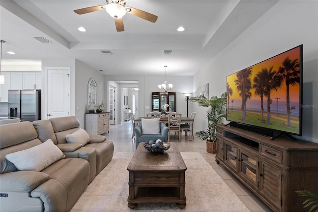 living area featuring recessed lighting, visible vents, a raised ceiling, and light tile patterned flooring