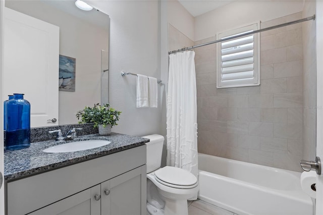 bathroom featuring shower / tub combo, vanity, and toilet