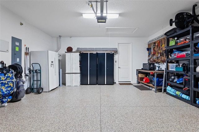 garage featuring white fridge with ice dispenser, electric panel, and a garage door opener