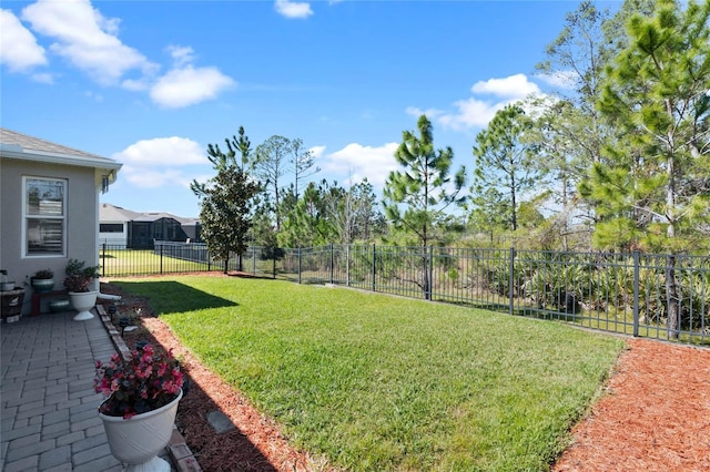 view of yard with a fenced backyard