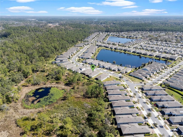 bird's eye view featuring a water view, a residential view, and a view of trees