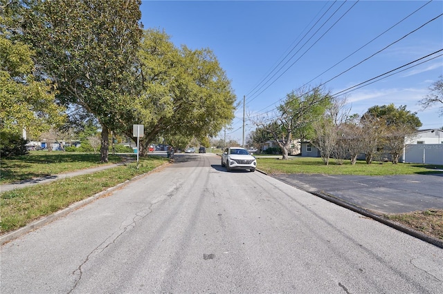 view of street with sidewalks and curbs