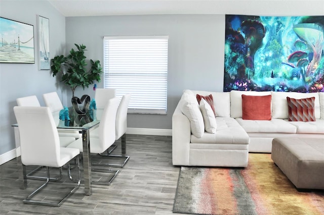 living room featuring wood finished floors and baseboards