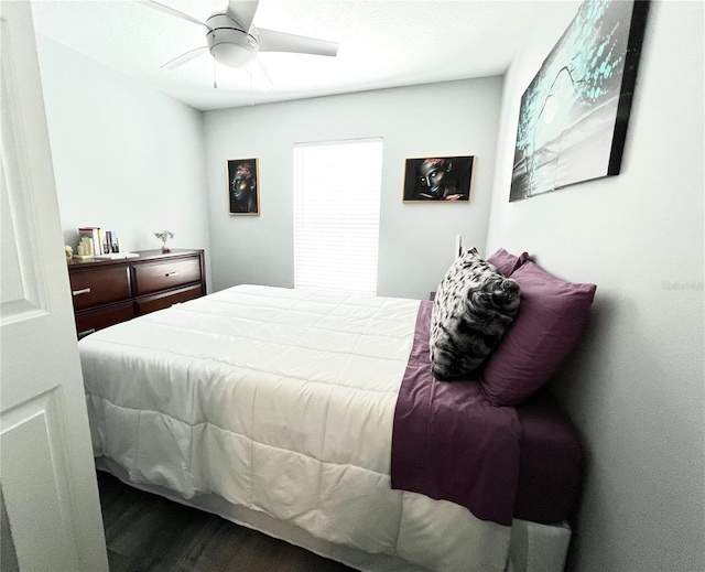 bedroom featuring a ceiling fan and wood finished floors