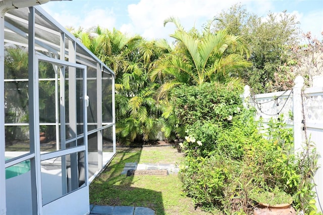 view of yard featuring a lanai