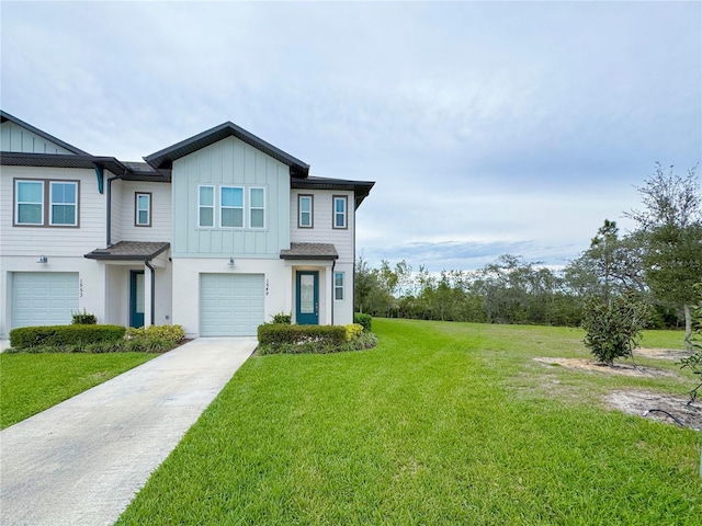 view of front facade featuring a garage, concrete driveway, a front lawn, and board and batten siding