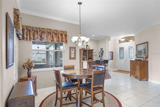 dining space with french doors, decorative columns, light tile patterned floors, ornamental molding, and baseboards