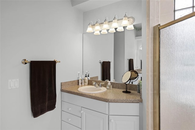 full bathroom featuring vanity and an enclosed shower