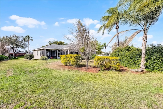 view of yard with a sunroom