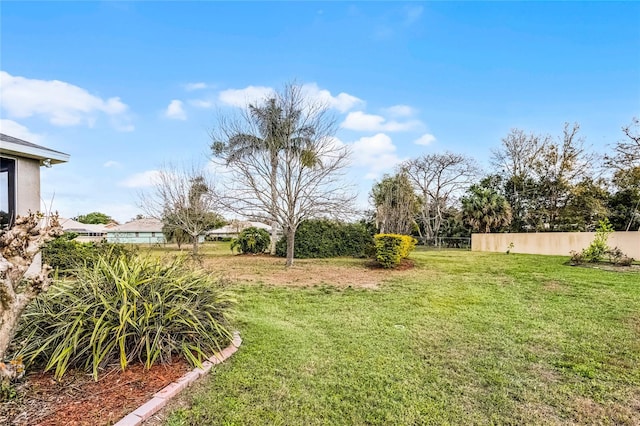 view of yard with fence