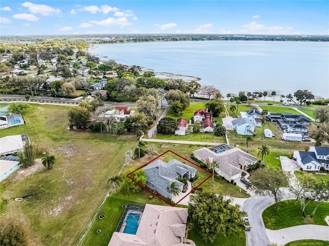 aerial view with a water view and a residential view