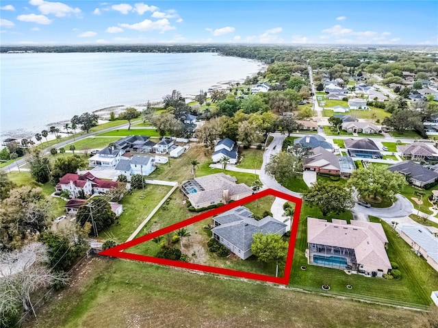 aerial view featuring a residential view and a water view