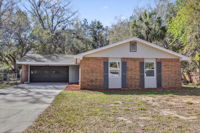 ranch-style home with a garage, concrete driveway, and brick siding