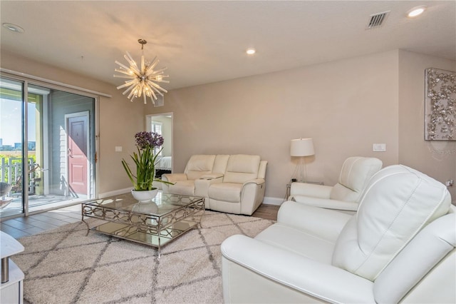 living area with recessed lighting, visible vents, wood finished floors, a chandelier, and baseboards