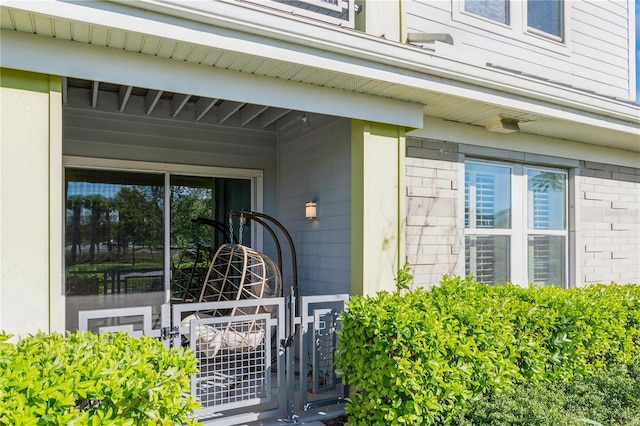 property entrance with brick siding