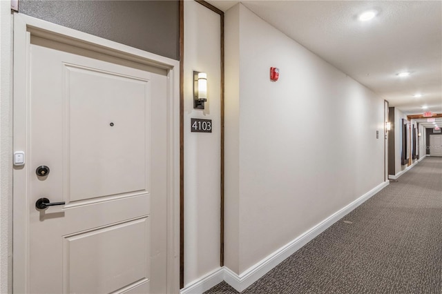 hall with baseboards, carpet flooring, and recessed lighting