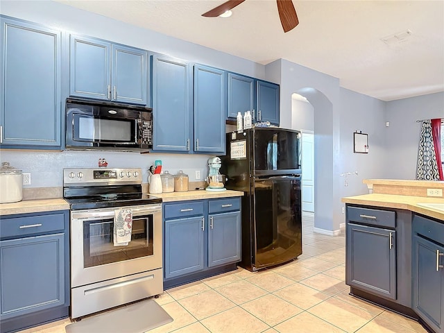 kitchen with arched walkways, blue cabinetry, and black appliances