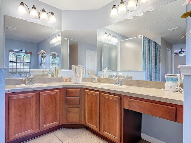 full bath with a sink, visible vents, and tile patterned floors