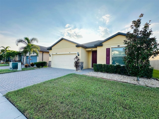 ranch-style house with decorative driveway, an attached garage, a front yard, and stucco siding