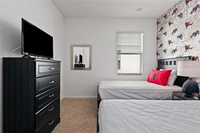 carpeted bedroom with baseboards