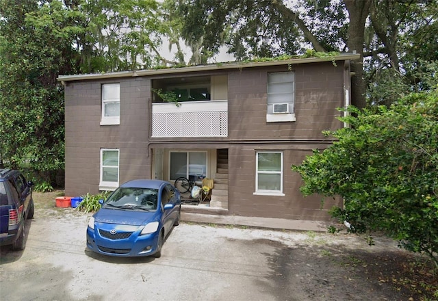 view of front of home with concrete block siding