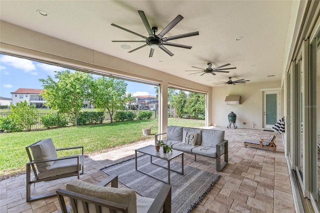 view of patio / terrace with a ceiling fan, fence, and an outdoor hangout area