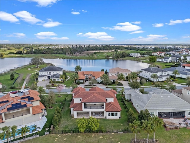 birds eye view of property with a water view and a residential view