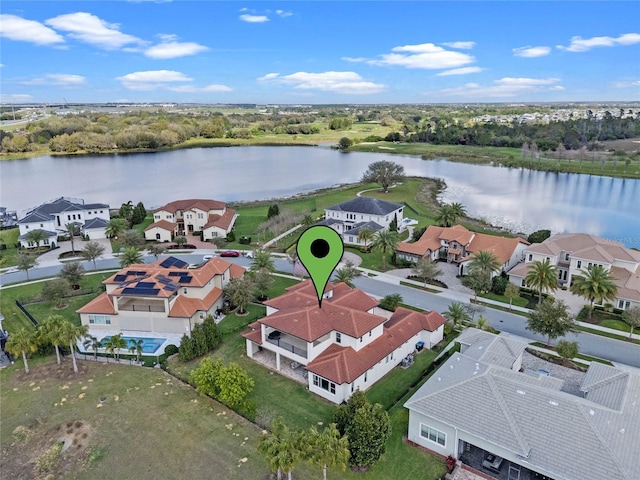 birds eye view of property featuring a residential view and a water view