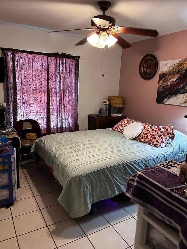 131 San Blas Ave, Kissimmee, FL 34743 - bedroom featuring light tile patterned flooring and a ceiling fan