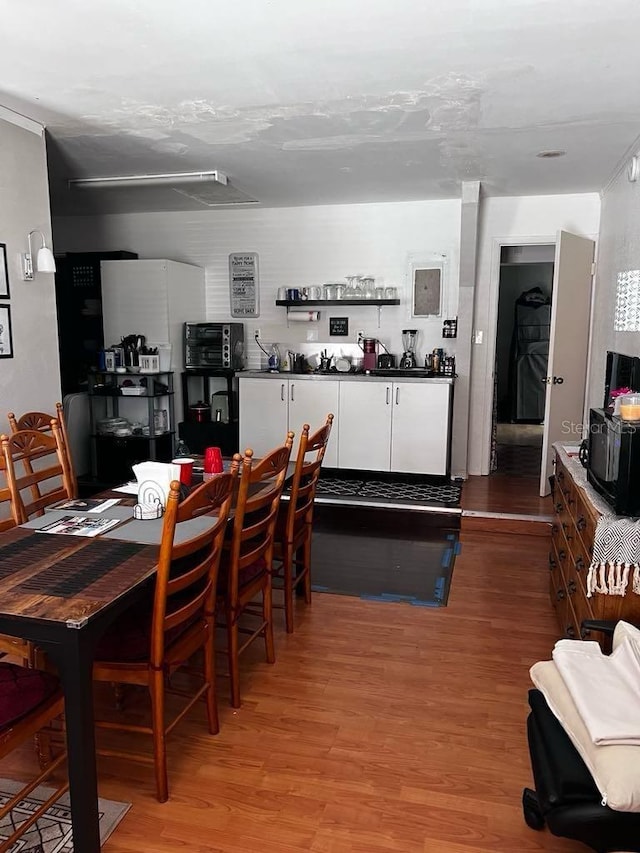 131 San Blas Ave, Kissimmee, FL 34743 - dining area featuring light wood finished floors
