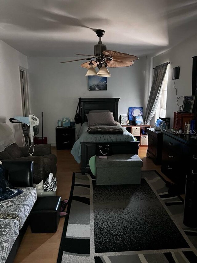 131 San Blas Ave, Kissimmee, FL 34743 - bedroom with a ceiling fan and wood finished floors