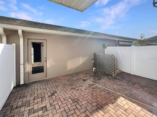 view of patio / terrace featuring fence