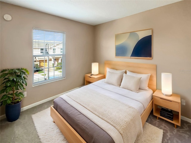 carpeted bedroom with baseboards