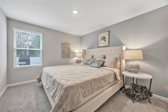 bedroom with carpet flooring and baseboards