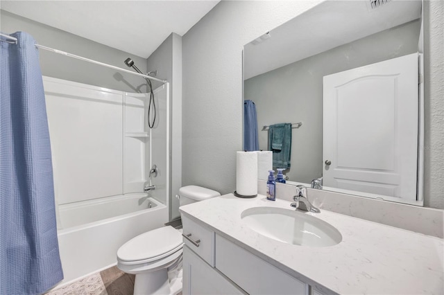 bathroom with vanity, toilet, and shower / bath combo with shower curtain