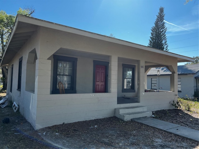 bungalow-style house featuring covered porch