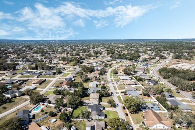 birds eye view of property with a residential view