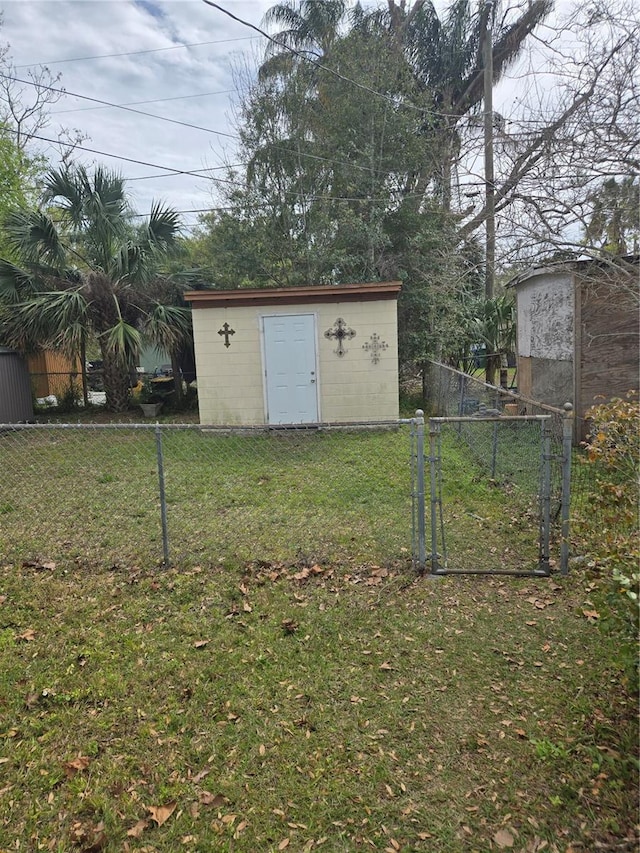 view of shed featuring a gate and fence