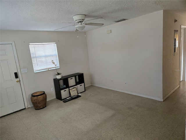 unfurnished room with a ceiling fan, light floors, and visible vents