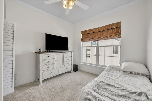 bedroom featuring baseboards, ornamental molding, and light colored carpet