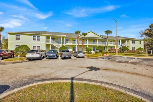 view of property with uncovered parking