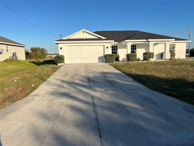 single story home with stucco siding, a shingled roof, concrete driveway, a front yard, and a garage